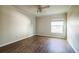 Bedroom featuring neutral walls, window and laminate floors at 545 Ne 45Th Ct, Ocala, FL 34470
