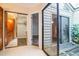 Hallway leading to closets, bathroom and a sliding door to outside deck at 545 Ne 45Th Ct, Ocala, FL 34470