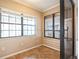 Cozy sunroom with lots of natural light, multiple windows, and tile flooring at 545 Ne 45Th Ct, Ocala, FL 34470