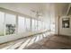 This sunroom has concrete floors and multiple ceiling fans at 545 Ne 45Th Ct, Ocala, FL 34470