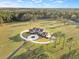 Expansive estate with a grand home, circular drive, lush grounds, and mature trees, providing privacy and scenic beauty at 5500 State Road 33, Clermont, FL 34714