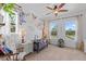 Sweet Bedroom with Winnie the Pooh themed wall art, lots of natural light and neutral decor at 5500 State Road 33, Clermont, FL 34714