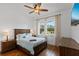Comfortable bedroom with hardwood floors, matching nightstands and dressers, and ample natural light at 5500 State Road 33, Clermont, FL 34714