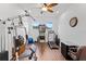 Exercise room with gym equipment, a pinball machine, and natural light from two windows at 5500 State Road 33, Clermont, FL 34714