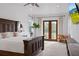 Bright main bedroom with hardwood frame bed, and access to the balcony with great natural lighting at 5500 State Road 33, Clermont, FL 34714