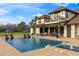Back of home with pool, outdoor dining, patio furniture, and a covered porch perfect for outdoor enjoyment at 5500 State Road 33, Clermont, FL 34714