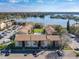 Aerial view of condo complex with lakefront views, pool, parking, and beautifully landscaped grounds at 562 Orange Dr # 33, Altamonte Springs, FL 32701