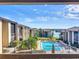 Community pool and buildings as seen from a balcony at 562 Orange Dr # 33, Altamonte Springs, FL 32701