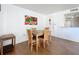 Cozy dining room featuring wood-look flooring, a wooden table, and artwork at 562 Orange Dr # 33, Altamonte Springs, FL 32701