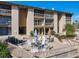 Exterior view of community buildings, landscaping, and courtyard with patio seating area at 562 Orange Dr # 33, Altamonte Springs, FL 32701
