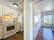 Practical kitchen with essential appliances, a doorway to the bedroom, and access to the hallway at 562 Orange Dr # 33, Altamonte Springs, FL 32701