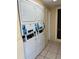 Stacked laundry machines with card readers, offering a convenient and space-saving solution at 562 Orange Dr # 33, Altamonte Springs, FL 32701