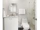Bathroom features a modern sink, a tiled shower, and ample lighting at 5950 Masters Blvd, Orlando, FL 32819