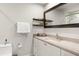 Bright bathroom featuring granite counters, a modern vanity, and a decorative mirror at 5950 Masters Blvd, Orlando, FL 32819