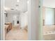 Well-lit bathroom featuring a glass-enclosed shower and dual vanity at 5950 Masters Blvd, Orlando, FL 32819