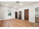 Bedroom with laminate flooring, rustic barn door, and custom shelving unit at 5950 Masters Blvd, Orlando, FL 32819