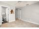 Bedroom featuring tile flooring, a ceiling fan, and access to an ensuite bathroom at 5950 Masters Blvd, Orlando, FL 32819
