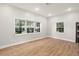 Bright bedroom with laminate flooring and large windows for natural light at 5950 Masters Blvd, Orlando, FL 32819