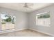 Bedroom featuring tile flooring and sunlit windows at 5950 Masters Blvd, Orlando, FL 32819