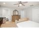 Bedroom with a ceiling fan, ensuite bath, and tiled floors at 5950 Masters Blvd, Orlando, FL 32819