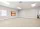 View of a spacious bonus room with carpeted floors and a window for natural light at 5950 Masters Blvd, Orlando, FL 32819