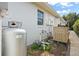 Exterior view showing the generator and propane tank, providing backup power and fuel for the property at 5950 Masters Blvd, Orlando, FL 32819