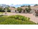 Close-up view of the lush landscaping, water fountain, and impressive brick driveway leading to the home at 5950 Masters Blvd, Orlando, FL 32819