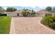 Stunning brick driveway and meticulously maintained landscaping showcasing the home's curb appeal at 5950 Masters Blvd, Orlando, FL 32819