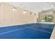 Bright game room with recessed lighting and a tennis net inside the property's spacious garage at 5950 Masters Blvd, Orlando, FL 32819