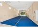 Bright game room featuring a tennis net with high ceilings, recessed lighting, and neutral walls at 5950 Masters Blvd, Orlando, FL 32819