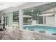 Kitchen island boasts bar stool seating and backyard pool views at 5950 Masters Blvd, Orlando, FL 32819