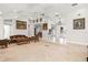 An open-concept living room with tile flooring, tray ceilings and views of the formal dining room at 5950 Masters Blvd, Orlando, FL 32819