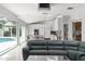 Bright open concept with an island, modern kitchen, and pool view at 5950 Masters Blvd, Orlando, FL 32819