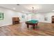 Billiard room with a piano and natural lighting from windows at 5950 Masters Blvd, Orlando, FL 32819