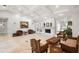 Light and bright living room with travertine floors, tray ceilings, and a beautiful fireplace at 5950 Masters Blvd, Orlando, FL 32819