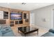 Spacious living room featuring a wooden entertainment center, and tile floors at 5950 Masters Blvd, Orlando, FL 32819