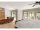 Well lit main bedroom featuring a fireplace, backyard view, and tile floor at 5950 Masters Blvd, Orlando, FL 32819