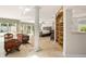 Spacious main bedroom with decorative furnishings, shelving, and tile flooring at 5950 Masters Blvd, Orlando, FL 32819