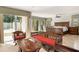 Main bedroom showcasing large windows, wooden furniture, and tile flooring at 5950 Masters Blvd, Orlando, FL 32819