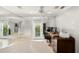 Bright office with mirrored wall, ceiling fan and door leading to garden at 5950 Masters Blvd, Orlando, FL 32819