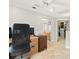Functional office space with built-in desk and storage, complemented by neutral decor and natural light at 5950 Masters Blvd, Orlando, FL 32819
