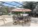 Covered outdoor dining space features a long table with seating, a fountain, and a built in bar at 5950 Masters Blvd, Orlando, FL 32819
