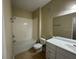 Bathroom featuring a single sink vanity, a toilet, and a tub at 6451 Old Park Ln # 302, Orlando, FL 32835