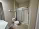 Bathroom featuring a single sink vanity, a toilet, and a shower at 6451 Old Park Ln # 302, Orlando, FL 32835
