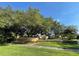 Well maintained community sign surrounded by landscaping, with inviting curb appeal at 6451 Old Park Ln # 302, Orlando, FL 32835
