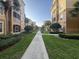 Lush landscaping and walkways offer serene outdoor spaces for residents to enjoy at 6451 Old Park Ln # 302, Orlando, FL 32835
