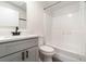 The bathroom features a modern single sink vanity and a shower-tub combo at 7322 Groveland Farms Rd, Groveland, FL 34736