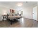 Bright bedroom with neutral decor, natural light, and wood-look floors at 7322 Groveland Farms Rd, Groveland, FL 34736
