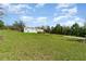 Grassy lot with home in the background at 7322 Groveland Farms Rd, Groveland, FL 34736