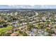 An aerial view of the neighborhood showcasing the home's location, nearby houses, and a private pool at 7325 Burnway Dr, Orlando, FL 32819